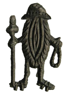 Vulva vestida de peregrina, insignia de estaño. Finales del siglo XIV o principios del XV, Países Bajos.

